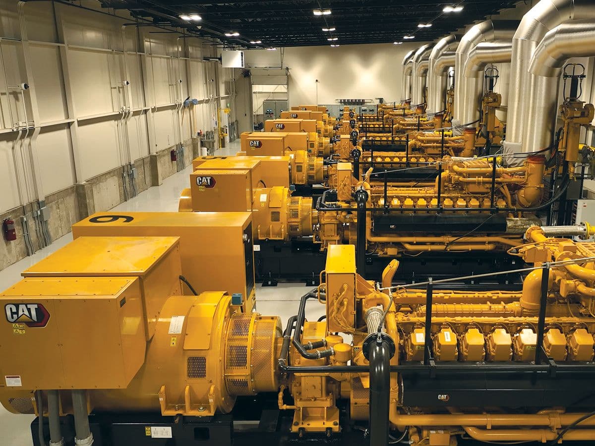 Row of CAT generator sets in a power plant facility